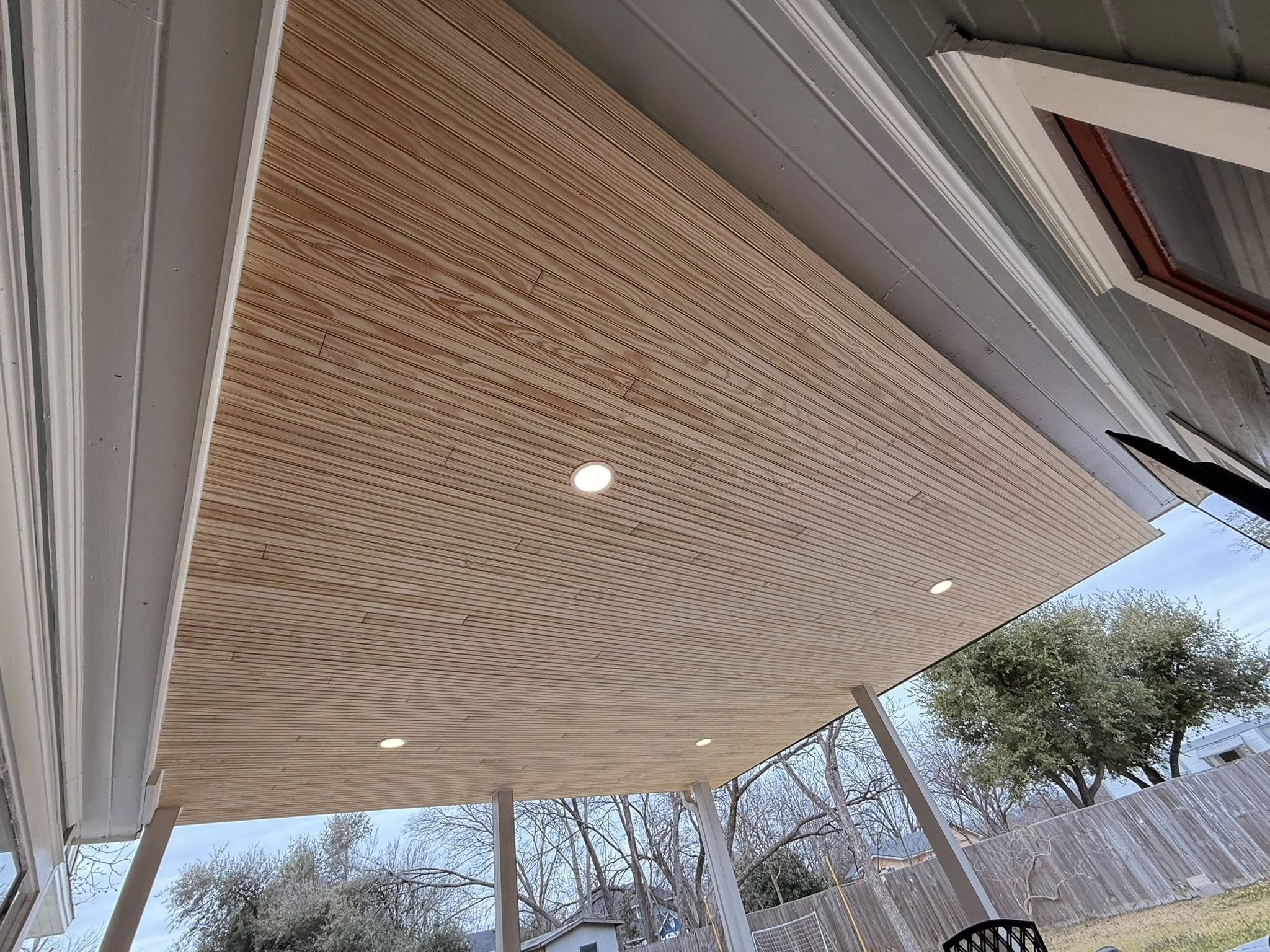 Cedar tongue-and-groove patio cover ceiling with recessed lighting