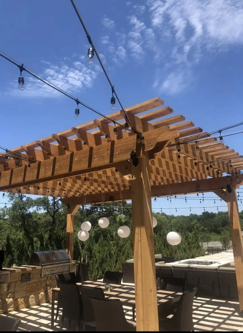 Cedar pergola with string lights at sunset, Austin Hill Country