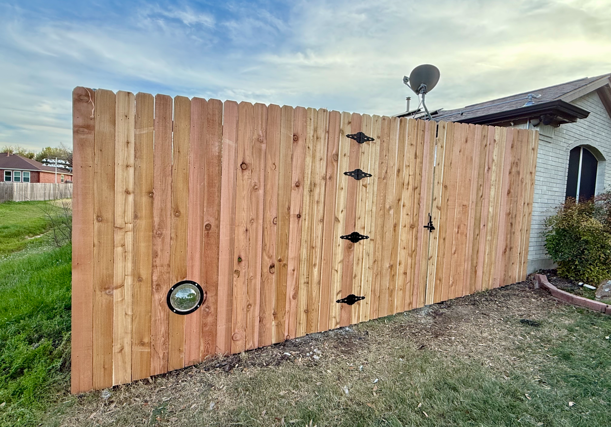 Cedar privacy fence with decorative hardware and gate, Austin TX
