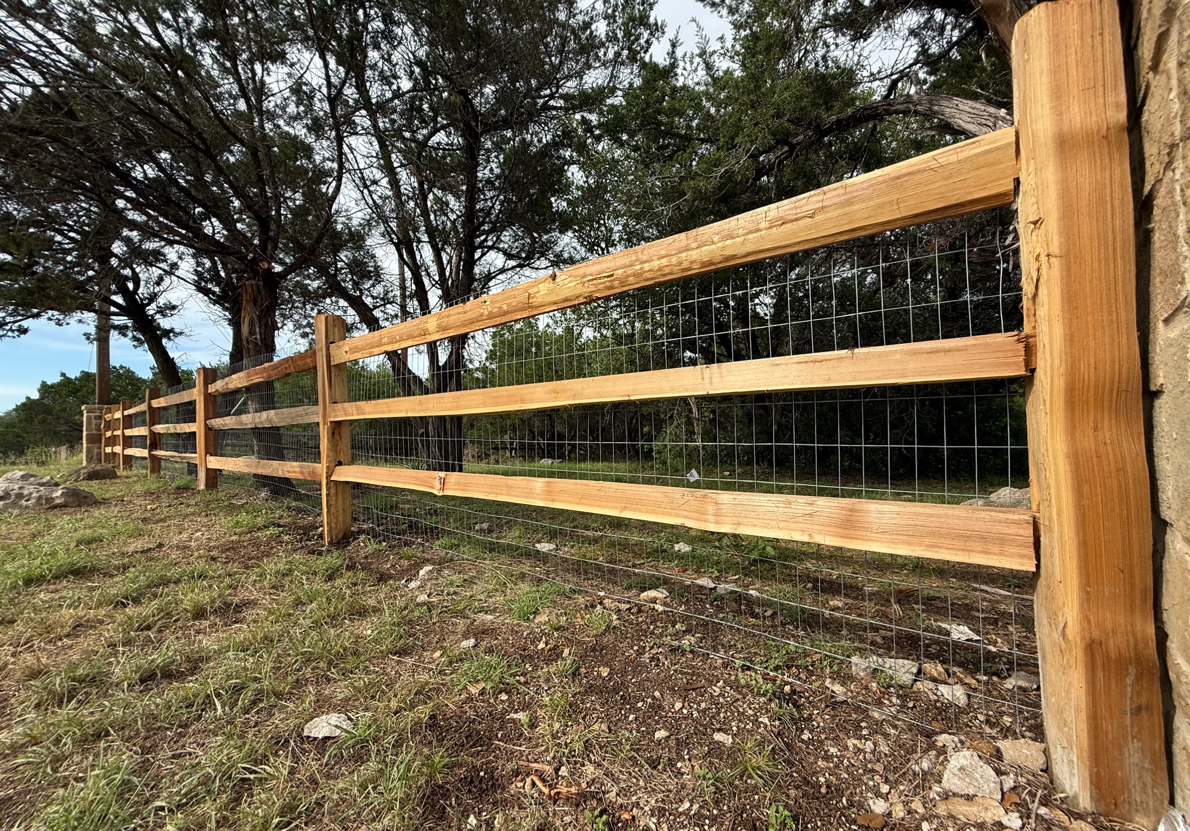 Cedar split-rail ranch fence in the Texas Hill Country